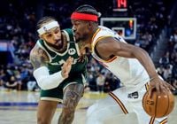 Butler scores 24 and Warriors win without Curry, 104-93 over Bucks