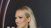 Carrie Underwood and Mike Fisher Make Rare Red Carpet Appearance for Opry 100