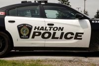 Off-duty officer charged after accidentally discharging firearm in Milton