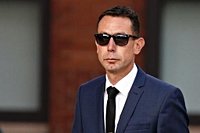 Sacked referee David Coote pleads not guilty to making indecent image of child