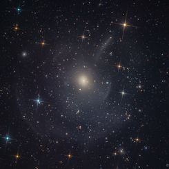  M89: Elliptical Galaxy with Outer Shells and Plumes 