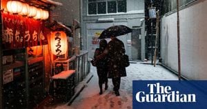 Snowfall Disrupts Traffic For Tokyo Commuters