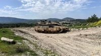 Israel PM offers 'phased' withdrawal if Lebanon disarms Hezbollah