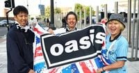 Oasis fans camped outside Cardiff stadium get very special surprise from band