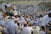 Muslim pilgrims ascend Mount Arafat, marking the holiest day of Hajj