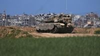 Israeli troops advance in Gaza to retake part of a corridor dividing north from south