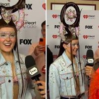 iHeartRadio Music Awards 2025: JoJo Siwa Explains Her Massive Crown & Red Carpet Look (Exclusive) - E! Online