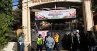 Multiple explosions shake a mosque in an Indonesian high school and injure 54
