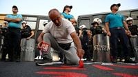 Greek protesters rally against an Israeli cruise ship as EU unions express anger over Gaza