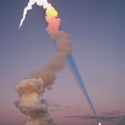 Shuttle Plume Shadow Points to the Moon