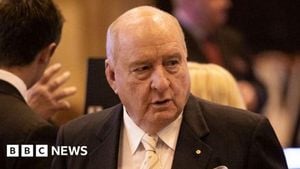 Alan Jones Charged With Sexual Assaults