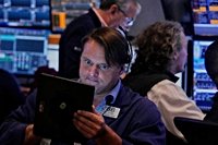 Wall Street holds at a standstill near its record heights