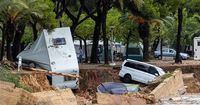 Floods trap people in cars in Spain as futher warnings issued