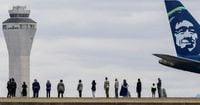Threat aboard plane halts flights at Sea-Tac Airport; 1 in custody