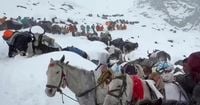Snowstorms strand hikers in China and a South Korean climber dies in Nepal