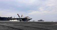 US Navy Super Hornet falls from deck of aircraft carrier engaged in Red Sea combat