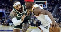 Butler scores 24 and Warriors win without Curry, 104-93 over Bucks