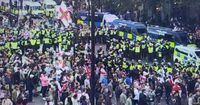 Tommy Robinson supporters attack police during 'Unite the Kingdom' rally