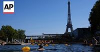 People swim in River Seine as temperatures soar in Paris