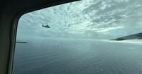 China's coast guard holds National Day celebrations at disputed shoal claimed by Philippines