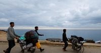 Gazans stream back home as Israel-Hamas ceasefire holds