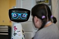 A robot programmed to act like a 7-year-old girl works to combat fear and loneliness in hospitals