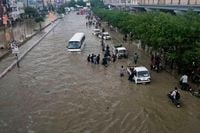Pakistan restores electricity and reopens roads in areas where floods killed over 300