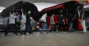 South Korean Workers Freed After Georgia Raid Return Home