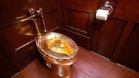 Storied solid gold toilet sculpture 