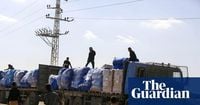 Israel limits aid into Gaza in dispute over hostage remains as ceasefire faces test