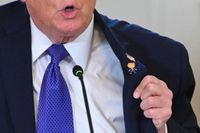 Trump dons ‘Happy Trump’ lapel pin at oil exec meeting