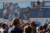 Freed Palestinian prisoners welcomed back to Gaza by huge crowds