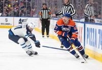 Connor scores in OT to lead Jets to 4-3 win over Oilers, who lost McDavid and Skinner to injuries