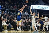 Stephen Curry, Jimmy Butler lead Warriors past Bucks, 120-113