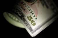 Dollar slips before US data, eyes on Trump-Putin meeting