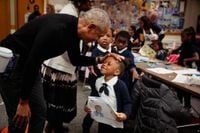 Barack Obama visits Chicago to check on his center’s progress — and makes a surprise school visit