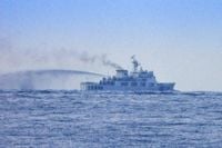 Philippines condemns China's swarm of forces near disputed shoal and vows to defend the territory