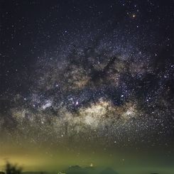  Milky Way over Erupting Volcano 