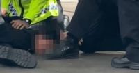 Boy, 16, jumped on by cops as he brandished 'gun' near Premier League game