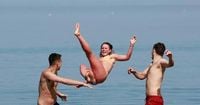 Scots flock to beaches and lochs to cool down as mercury gets close to 25C