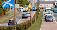 Anti-racists 'threatened with slit throats' after removing Saltire from lamppost