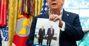 Trump Displays Putin Photo Amid Ukraine Tensions