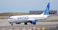 A passenger says a United pilot forcibly removed him from an airplane bathroom. Now he is suing