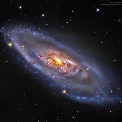  M106: A Spiral Galaxy with a Strange Center 