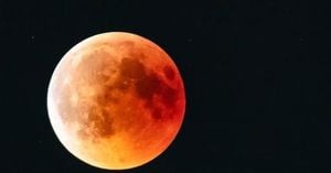 Strawberry Moon Rises Low Bringing Rare Red Glow