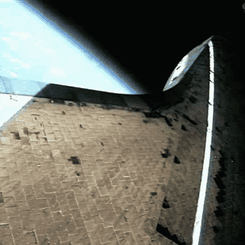 A Space Shuttle Climbs to Orbit