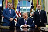 Trump signs order to fight state AI laws