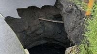 Homes evacuated as huge '50ft deep' sinkhole opens up sparking major incident