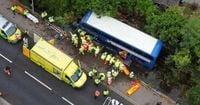 Bus crashes through railings into river with huge emergency response