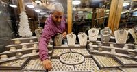 Gold ticks up on safe-haven demand, Fed decision awaited
